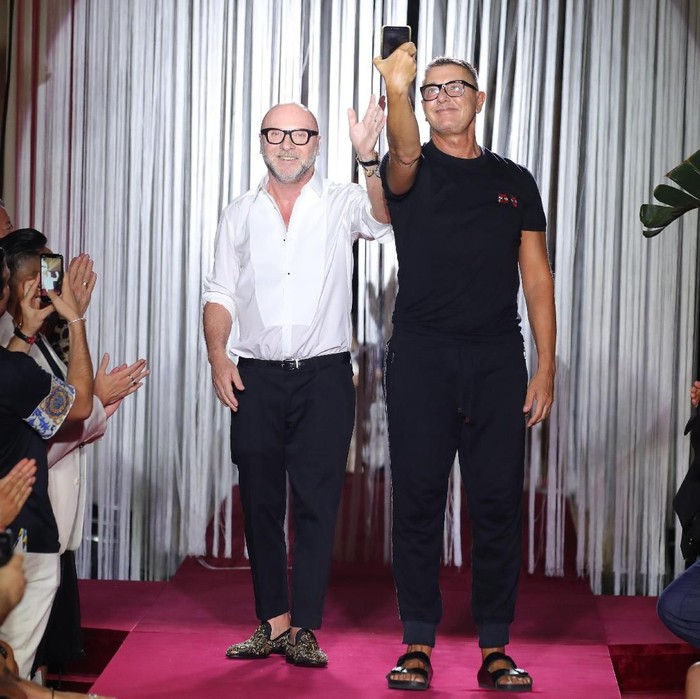 MILAN, ITALY - JUNE 16:  Designer Domenico Dolce and Stefano Gabbana acknowledge the applause of the audience at the Dolce & Gabbana Naked King Secret Show show during Milan Men's Fashion Week Spring/Summer 2019 on June 16, 2018 in Milan, Italy.  (Photo by Andreas Rentz/Getty Images)
