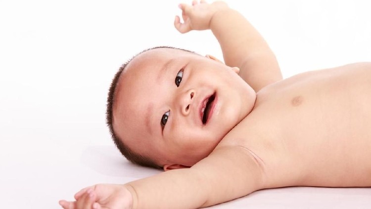 A happiness lying Oriental baby boy