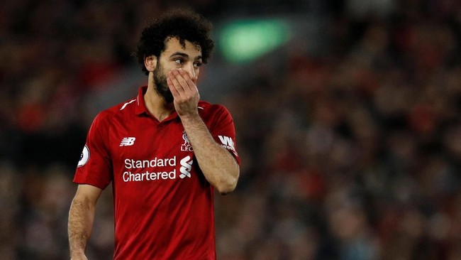 Mantan striker Liverpool, Emile Heskey, mengatakan Mohamed Salah terlalu terobsesi menjadi Cristiano Ronaldo dan Lionel Messi untuk selalu mencetak gol.