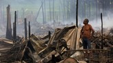 FOTO: Si Jago Merah Lalap 600 Rumah di Brasil Kebakaran besar-besaran melalap sekitar 600 rumah kayu yang didirikan di bantaran sungai Amazon di Brasil pada Selasa (18/12).