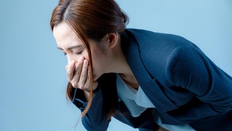 young woman feeling nauseated.