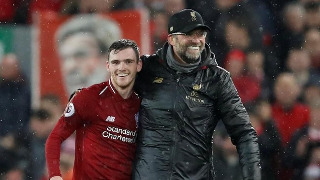 Bek kiri Liverpool, Andy Robertson, yakin menjadi juara juara Liga Primer Inggris akan membuat mereka setara dengan Manchester City.