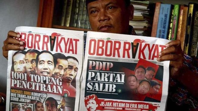 Kubu Jokowi Seret Obor Rakyat ke Ranah Hukum Bila Fitnah Lagi Kubu Jokowi-Ma'ruf memninta masyarakat maupun para pendukungnya mewaspadai Obor Rakyat yang punya rekam jejak pidana karena berita hoaks.