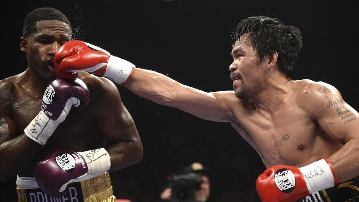 FOTO: Pacquiao Kalahkan Broner Lewat Kemenangan Angka Mutlak