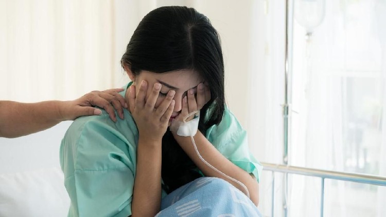 954846996 Asian young woman patient receiving bad news, Woman patient is desperate and crying. Her Mother support and comforting her patient with sympathy.