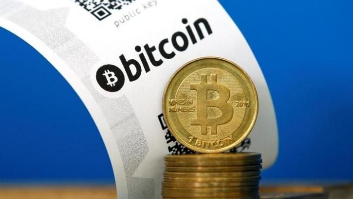 A Bitcoin (virtual currency) paper wallet with QR codes and coins are seen in an illustration picture taken at La Maison du Bitcoin in Paris July 11, 2014. REUTERS/Benoit Tessier
