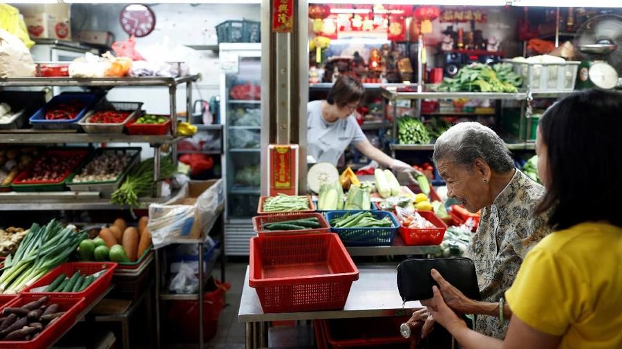 Hawker Leong Yuet Meng, 90, of Nam Seng Noodle House, does her daily shopping for ingredients at a market in Singapore February 22, 2019. Picture taken February 22, 2019. REUTERS/Edgar Su