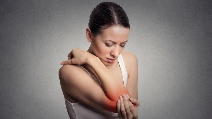 Woman's leg hurts, pain in the foot, massage of female feet at home