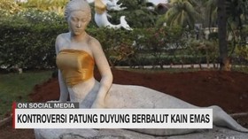Kontroversi Patung Duyung Berbalut Kain Emas