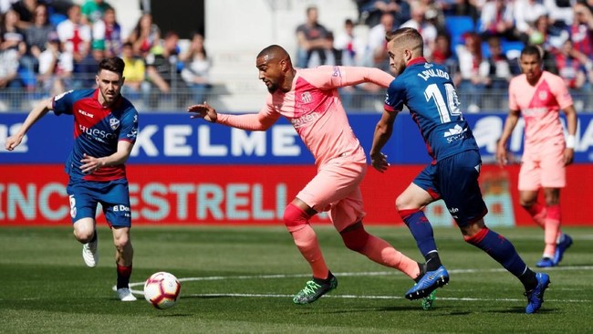 Bermain tanpa Lionel Messi, Barcelona harus puas bermain imbang lawan tim juru kunci SD Huesca dalam laga Liga Spanyol.