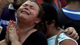 FOTO: Bangunan Runtuh di Rio de Janeiro Telan Korban Bangunan runtuh di Rio de Janeiro, Brasil menelan dua korban meninggal. Insiden itu mengungkap sepak terjang milisi yang menguasai lahan.