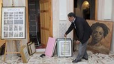FOTO: Geliat Seni di Tengah Kecamuk Perang Tripoli Tak seperti kebanyakan warga Libya yang memilih pindah karena kota tua Tripoli terbengkalai akibat perang, Mustafa Iskandar justru membuka galeri seni.