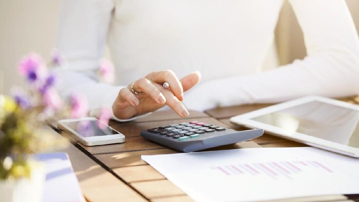 Businesswoman using calculator