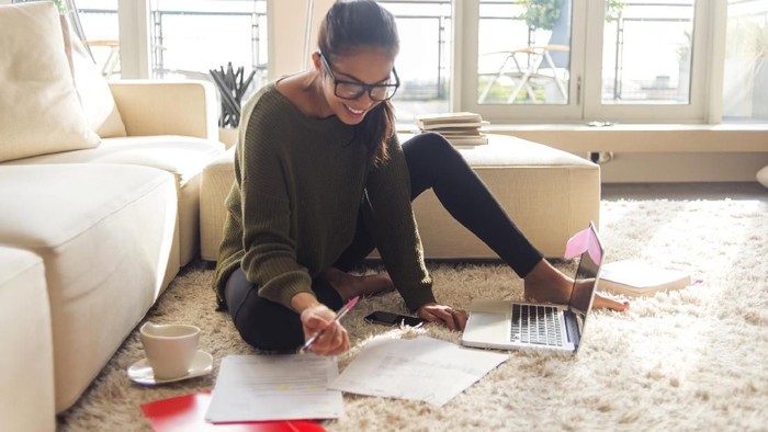 Close up of female accountant or banker making calculations