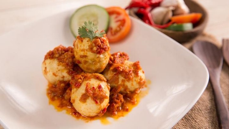 telur balado, boiled egg served with tomato and chili paste, or sambal. indonesian food