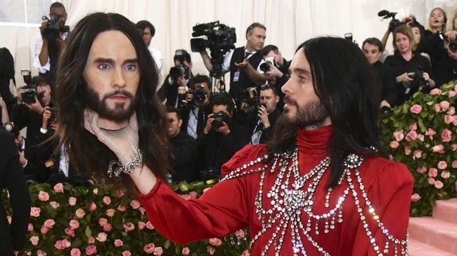 Jared Leto, holding a model of his own head, attends The Metropolitan Museum of Art's Costume Institute benefit gala celebrating the opening of the 