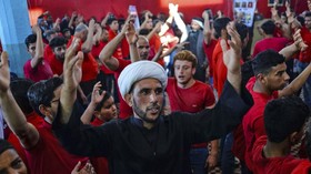 FOTO : Lantunan Musik Rap dan Ibadah Kaum Syiah Irak