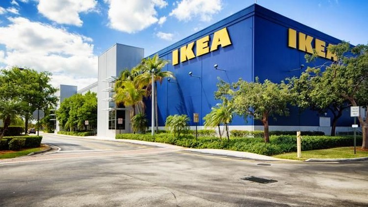 Corner view of the Ikea furniture store in Sunrise Florida near Fort Lauderdale on a mostly sunny Winter day. The image features the typical blue store with the yellow logo on its wall.