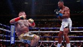 FOTO: Kejutan Andy Ruiz Menang TKO Atas Anthony Joshua Petinju asal Meksiko Andy Ruiz Jr. secara mengejutkan menjadi juara dunia kelas berat setelah menang TKO atas Anthony Joshua.