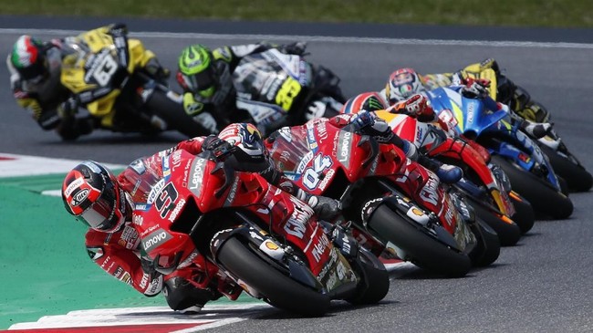 Italy's Danilo Petrucci leads Italy's Andrea Dovizioso, Spain's Marc Marquez, and Spain's Alex Rins during the MotoGP Grand Prix of Italy at the Mugello circuit, in Scarperia, Italy, Sunday, June 2, 2019. (AP Photo/Antonio Calanni)