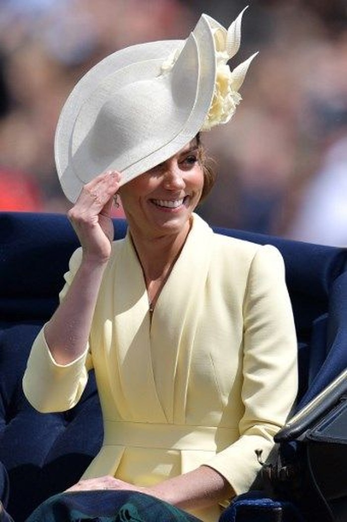 Britain's Catherine, Duchess of Cambridge (R) smiles as she chats to Britain's Meghan, Duchess of Sussex as they return to Buckingham Palace after the Queen's Birthday Parade, 'Trooping the Colour', in London on June 8, 2019. - The ceremony of Trooping the Colour is believed to have first been performed during the reign of King Charles II. Since 1748, the Trooping of the Colour has marked the official birthday of the British Sovereign. Over 1400 parading soldiers, almost 300 horses and 400 musicians take part in the event. (Photo by Daniel LEAL-OLIVAS / AFP)