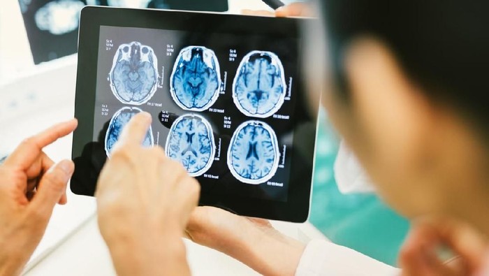Doctor and patient using digital tablet