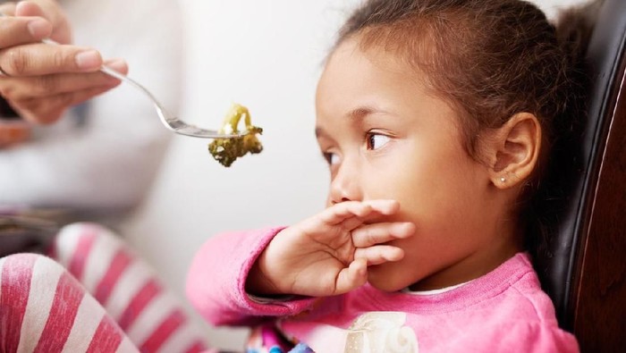 Shot of a little girl refusing to eat her food