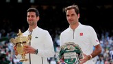 FOTO: Duel Melelahkan Djokovic vs Federer di Final Wimbledon Novak Djokovic bertanding selama lima jam sebelum menyudahi perlawanan Roger Federer lewat pertarungan lima set di final Wimbledon 2019, Minggu (14/7).