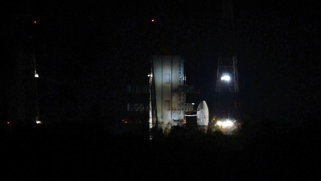 Indian Space Research Organisation's (ISRO) Chandrayaan-2, on board the Geosynchronous Satellite Launch Vehicle (GSLV-mark III-M1), sits on the launch pad after the launch was scrubbed due to a technical snag in Sriharikota in the state of Andhra Pradesh, India in the early hours of the day on July 15, 2019. (Photo by ARUN SANKAR / AFP) / “The erroneous mention[s] appearing in the metadata of this photo by ARUN SANKAR has been modified in AFP systems in the following manner: [2019] instead of [2018]. Please immediately remove the erroneous mention[s] from all your online services and delete it (them) from your servers. If you have been authorized by AFP to distribute it (them) to third parties, please ensure that the same actions are carried out by them. Failure to promptly comply with these instructions will entail liability on your part for any continued or post notification usage. Therefore we thank you very much for all your attention and prompt action. We are sorry for the inconvenience this notification may cause and remain at your disposal for any further information you may require.”