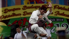 FOTO: Menikmati Lebaran Betawi, dari Tanjidor Hingga Silat