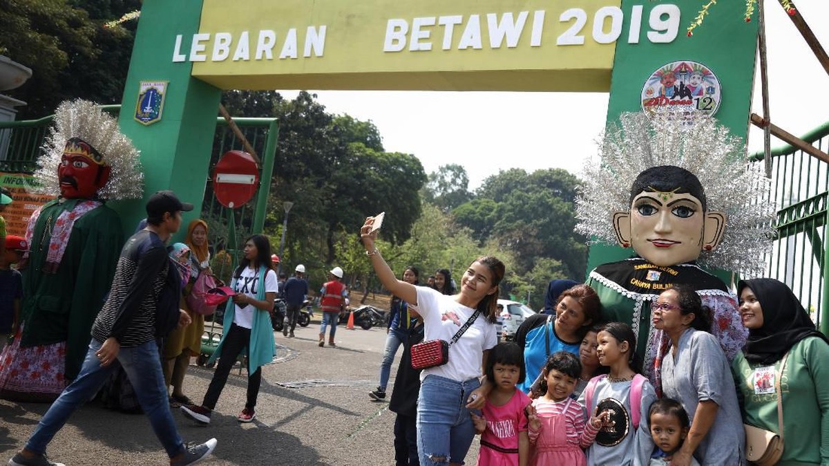 FOTO: Menikmati Lebaran Betawi, dari Tanjidor Hingga Silat