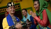 FOTO: Menikmati Lebaran Betawi, dari Tanjidor Hingga Silat Untuk kali ke-12, Lebaran Betawi digelar di Jakarta dengan menampilkan berbagai kebudayaan, mulai dari kesenian hingga kuliner.