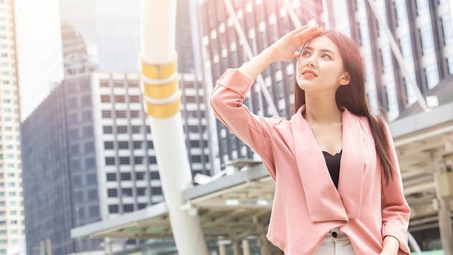 1054745064 Asian office women skin damage from sun UV city air pollution concept
