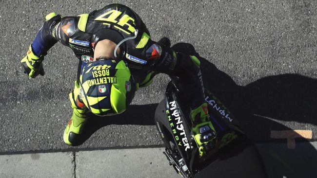 Italian rider Valentino Rossi of the Monster Energy Yamaha MotoGP walks in the pit lane during a warm up session for the MotoGP race at the Czech Republic motorcycle Grand Prix at the Automotodrom Brno, in Brno, Czech Republic, Sunday, Aug. 4, 2019. (AP Photo/Petr David Josek)