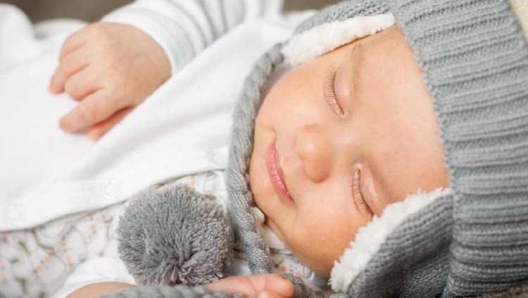 Ilustrasi bayi laki-laki 2 months old infant sleeping and smiling in his sleep.