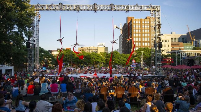 A crowd watches a performance of 