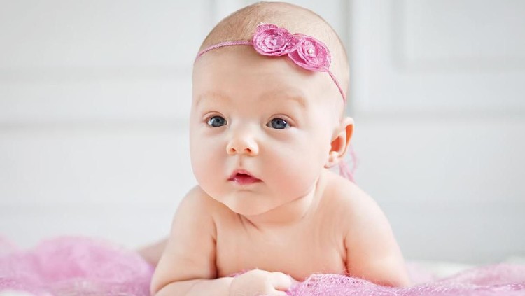 931031552 Cute baby girl crawling. Shallow DOF. Developed from RAW; retouched with special care and attention; Small amount of grain added for best final impression. 16 bit Adobe RGB color profile.