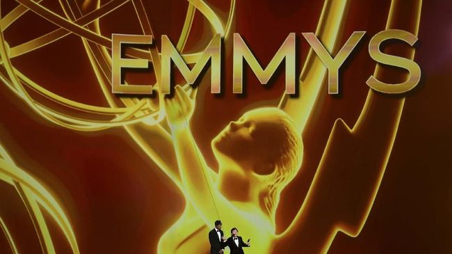 Actors Ken Jeong (R) and Nick Cannon (L) speak onstage during the 71st Emmy Awards at the Microsoft Theatre in Los Angeles on September 22, 2019. (Photo by Frederic J. BROWN / AFP)