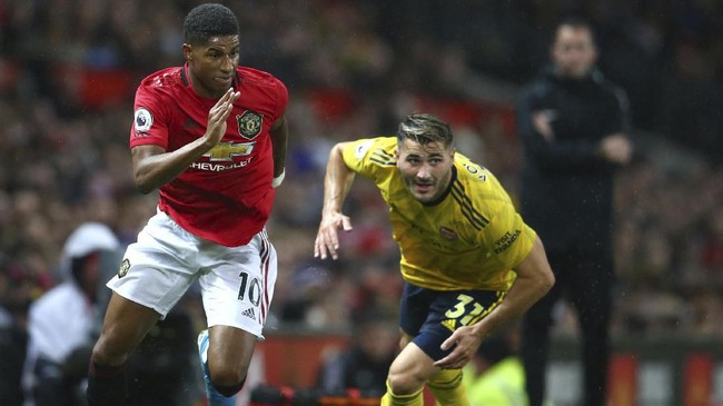 Duel Manchester United vs Arsenal pada lanjutan Liga Inggris di Old Trafford berakhir antiklimaks setelah berakhir dengan skor imbang 1-1.