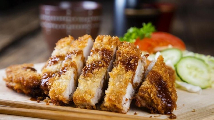 A plate of authentic Japanese pork tonkatsu.