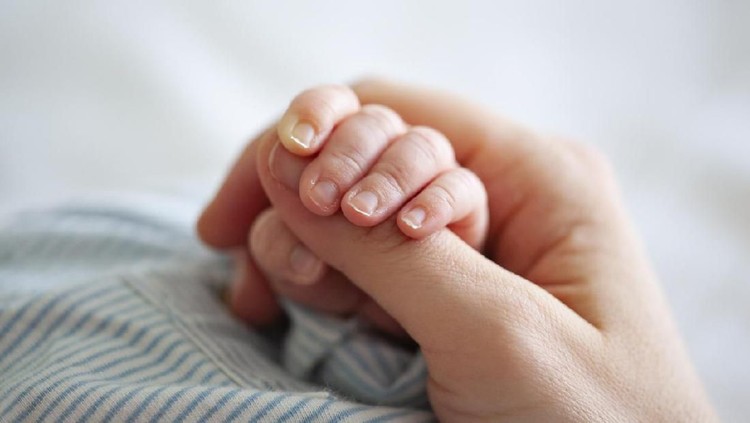 Baby Boy Holding Mothers Hand