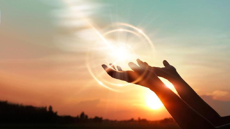 Woman hands praying for blessing from god on sunset background