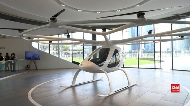 Grab Gandeng Volocopter Uji Coba Layanan Taksi Udara Moda transportasi Volocopter digadang-gadang bakal menjadi salah satu solusi menghindari kemacetan, kepadatan penduduk, dan penutupan jalan.