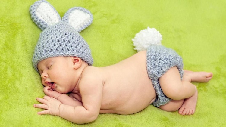 Little bunny. Photo session of a newborn in a rabbit costume.