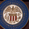 The seal of the Board of Governors of the Federal Reserve System is seen on the lectern during a press conference September 17, 2014 at the US Federal Reserve in Washington, DC. AFP PHOTO/Paul J. Richards