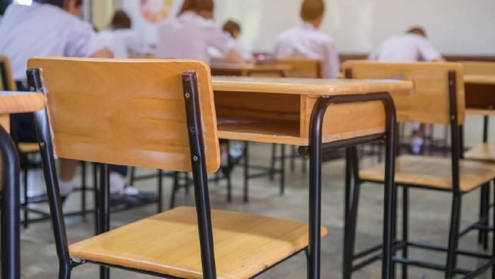 Lecture room or School empty classroom with Student taking exams, writing examination for studying lessons in high school thailand, interior of secondary education, whiteboard. educational concept
