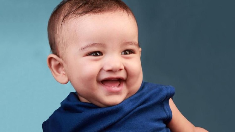 Baby boy Portrait of a cute baby against color background