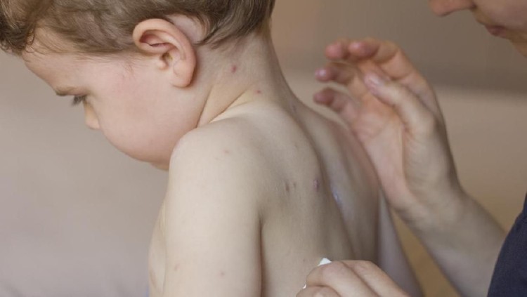 Mother nursing sick child At Home