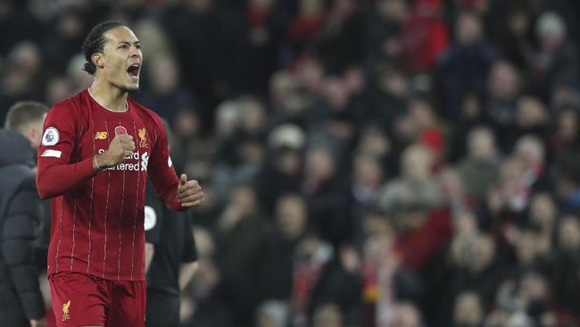Liverpool's Virgil van Dijk celebrates at the end of the English Premier League soccer match between Liverpool and Manchester City at Anfield stadium in Liverpool, England, Sunday, Nov. 10, 2019. Liverpool won 3-1. (AP Photo/Jon Super)