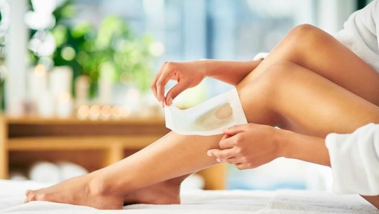 Cropped shot of an unrecognizable woman waxing her legs